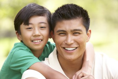 Father And Son In Park clipart