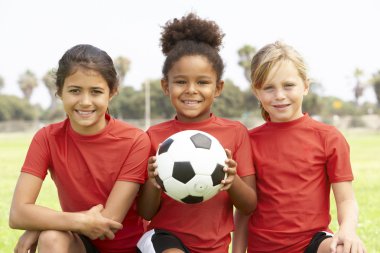 Young Girls In Football Team clipart