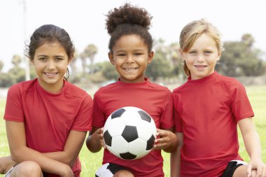 Young Girl In Football Team clipart