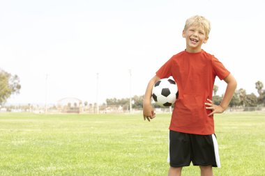 Young Boy In Football Team clipart