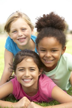 Young Girls In Playing In Park clipart