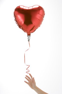 Hand Letting Go Of Heart Shaped Balloon clipart