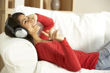 Young Woman Listening To Music clipart