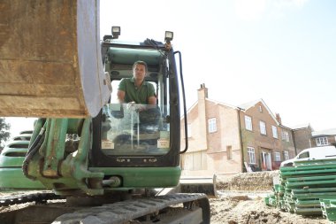 Construction Worker Using Digger clipart