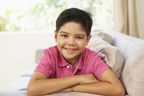 Young Boy Relaxing On Sofa At Home — Stock Photo, Image