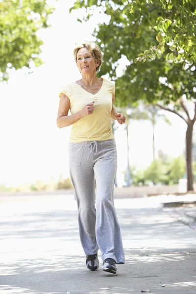 Senior Woman Jogging In Park — Stock Photo, Image