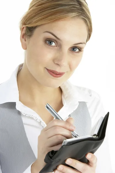 Blonde Businesswoman Writing In Diary — Stock Photo, Image
