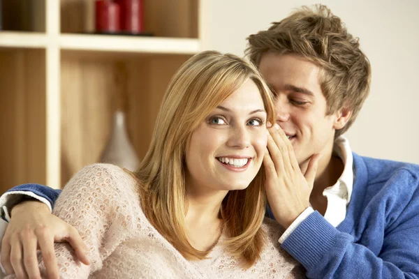 Young Couple Whispering To Each Other — Stock Photo, Image