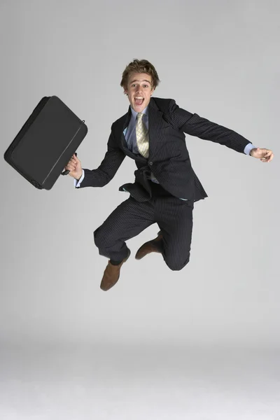 Uomo d'affari che salta in aria — Foto Stock