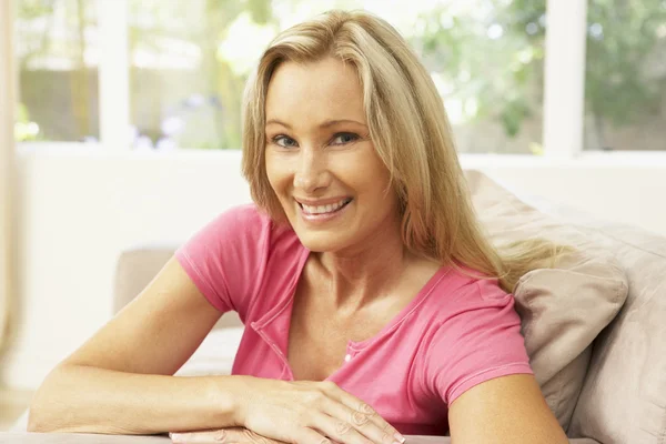 Woman Relaxing On Sofa At Home — Stock Photo, Image