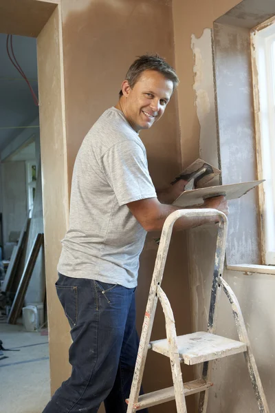 Plasterer Working On Interior Wall Royalty Free Stock Images