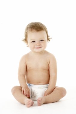 Studio Portrait Of Baby Boy Sitting clipart