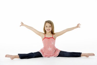 Young Girl In Gymnastic Pose Doing Splits clipart