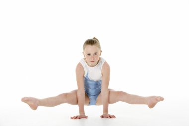 Studio Portrait Of Young Female Gymnast clipart