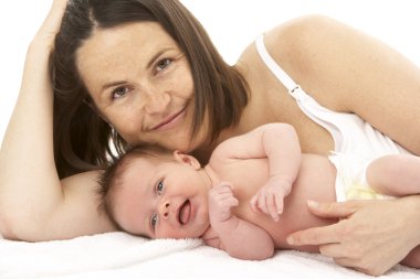 Mother Holding Newborn Baby clipart