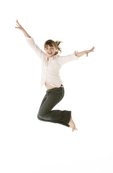 Studio Shot Of Young Girl Jumping In Studio — Stock Photo, Image
