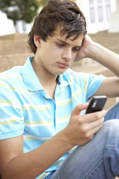 Olycklig Manlig Teenage Student Sitter Utanför College Steg Oss — Stockfoto
