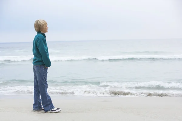 Young Boy Holiday Standing Winter Beach Looking Out Sea — Stock Photo, Image
