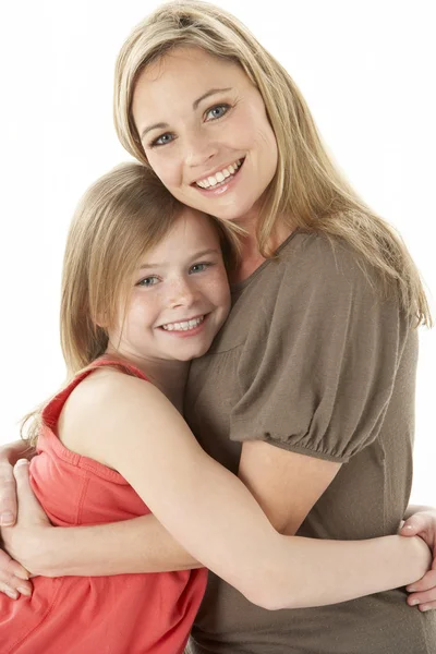 Studio Portrait Mother Hugging Young Daughter Royalty Free Stock Photos