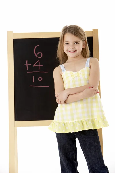 Young Girl Looking Thoughtful Next Blackboard Royalty Free Stock Photos