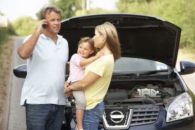 Family Broken Down On Country Road clipart