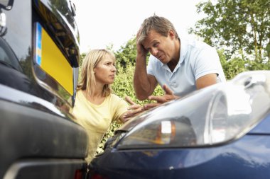 Man And Woman Having Argument After Traffic Accident clipart