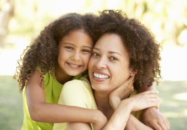 Portrait Of Mother And Daughter In Park clipart