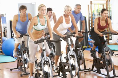 Group Of In Spinning Class In Gym clipart