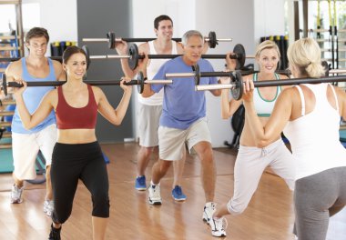 Group Of Lifting Weights In Gym clipart