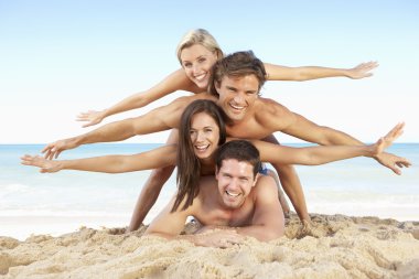 Group Of Friends Enjoying Beach Holiday clipart