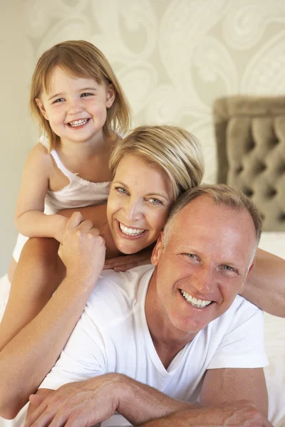 Family Relaxing In Bedroom — Stock Photo, Image