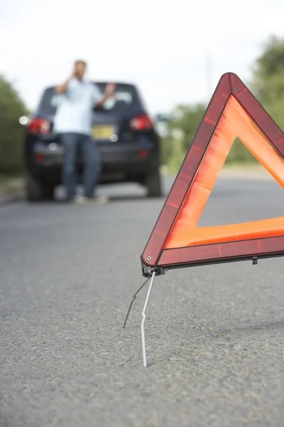 Driver Broken Down On Country Road With Hazard Warning Sign In F — Stock Photo, Image