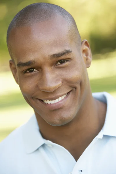 Portrait Of Young Man Sitting In Park — Stock Photo, Image