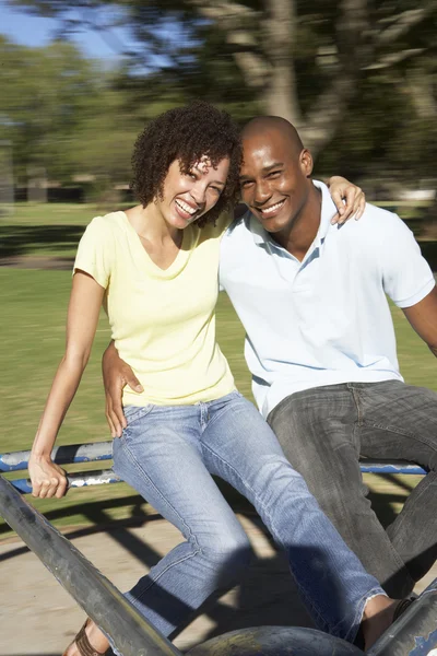 Young Couple Riding Roundabout Park — Stock Photo, Image