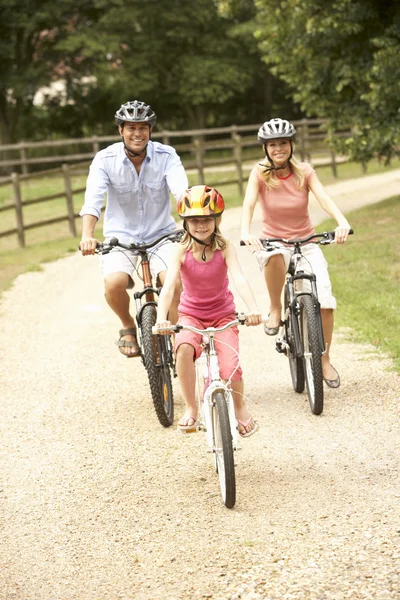 Family Cycling Countryside Wearing Safety Helmets — Stock Photo, Image