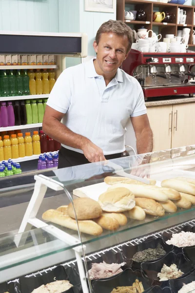Man Working Behind Counter — Stock Photo, Image