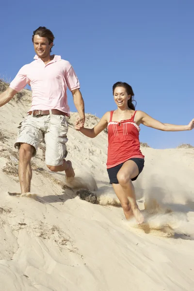 Couple Enjoying Beach Holiday Running Dune — Stock Photo, Image