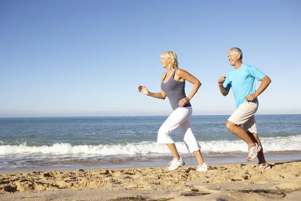 Senior Couple Fitness Clothing Running Beach — Stock Photo, Image