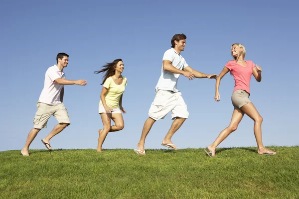 Young Couples Running Field — Stock Photo, Image