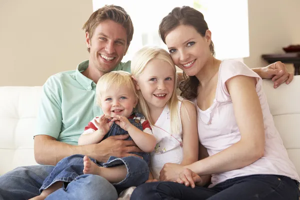 Family Sitting On Sofa At Home Together — Stock Photo, Image