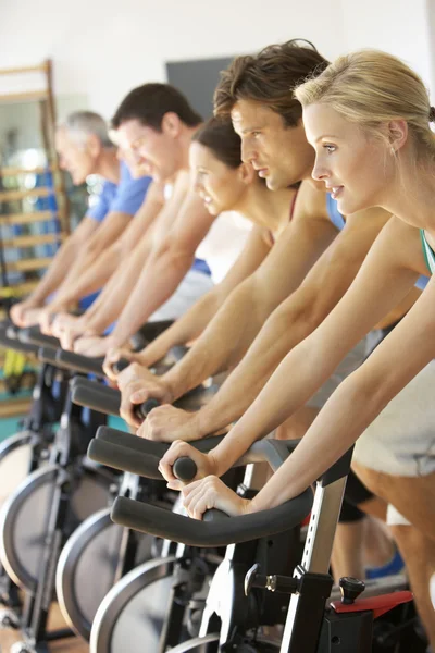 Man Cycling In Spinning Class In Gym Stock Image