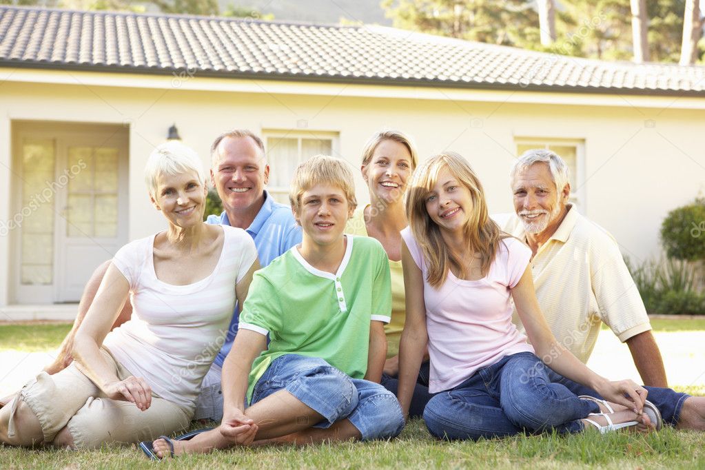 Extended Family Sitting Outside Dream Home — Stock Photo