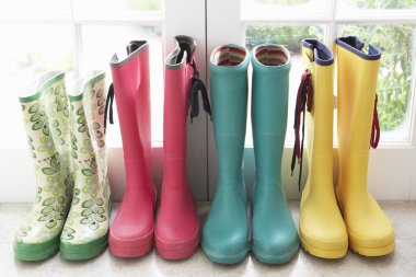 A display of colorful rain boots clipart