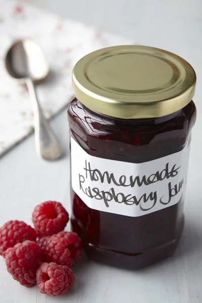 A still life of raspberry jam in jar — Stock Photo, Image