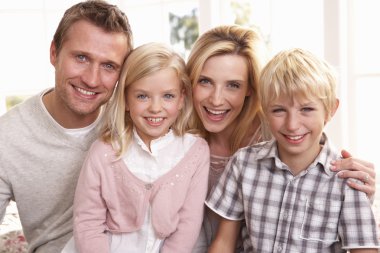 Young family pose together clipart