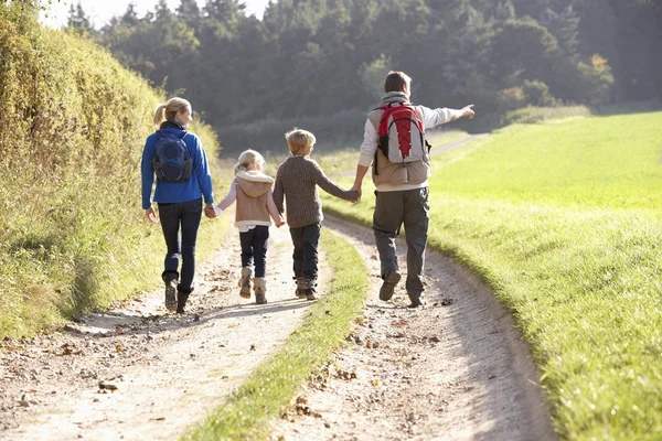 Young family walking in park — Stock Photo, Image
