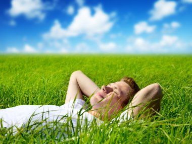 Young man in grass clipart