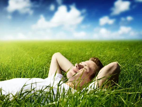 Young man in grass — Stock Photo, Image