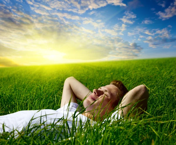 Young man in grass — Stock Photo, Image