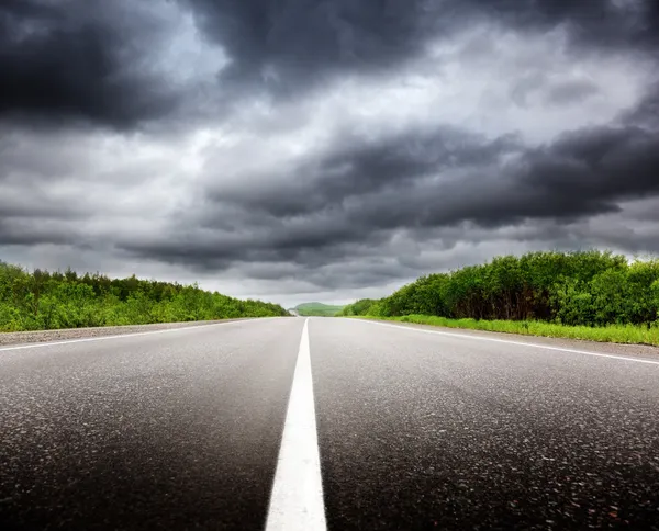 Black clouds and road — Stock Photo, Image